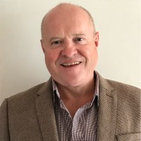 Damian Crilly GCGI MSyI