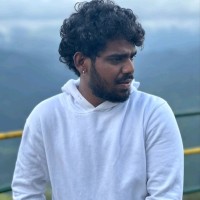 Kamesh E