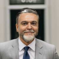 Glyn E.