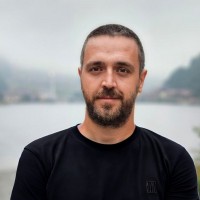 ERHAN COMERT