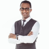 Tinesh G