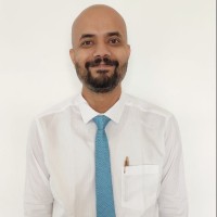 Dr Arkesh M