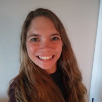 Laura E.