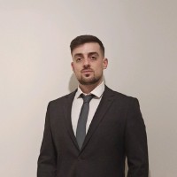 Andreas Bouzoukas, Acca