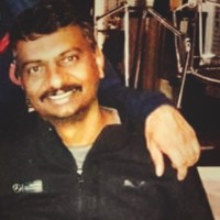 Ashok E
