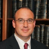 Justin Heather, CEcD