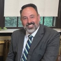 John T. Peculis