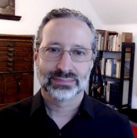 Keiron Simons (he/him)