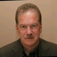 John M Stapleton B.A. C.R.A L.U.A.T.C
