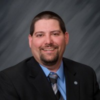 Travis A. Breunig, Mba