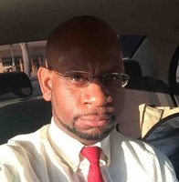 Gregory J White