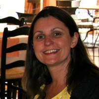 JOY C.