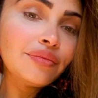 Thaina B.