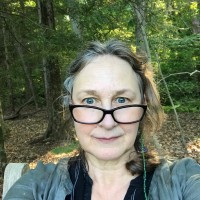 E Kim Warman