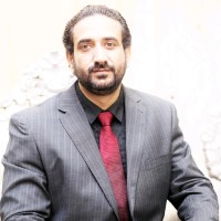 Maj Sajid Akbar (R)