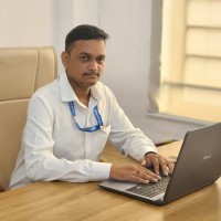 Dr.Manmohan B.