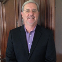 Keith Sprague,  P.G.