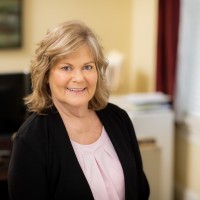 Lore Baker, AIC, AINS, AIC-M