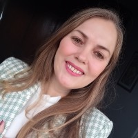 Carla Oliveira (She/Her)
