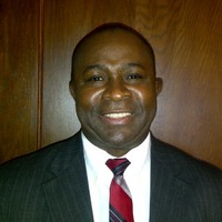 Dr. Michael Udofot.  Ph.D., MISM, GCISM, MS, BBA, AA