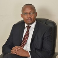 Samuel M. Kamunyu Njoroge MA(Econ), MCSI(UK), CIFA(K), CKM(USA), FESK, MKIM, M.IoD(K),