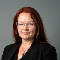 Mitzi B.