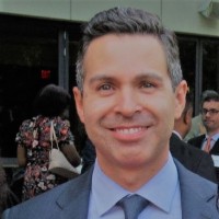 E. Carlos Dominguez