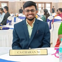 Charan M