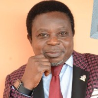 Dr. Charles Agede