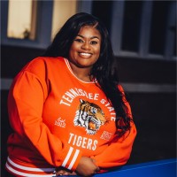 D’Andra Moore , B.S