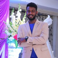 Charan E