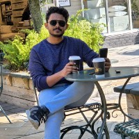 Rishad E