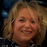 Judi B.