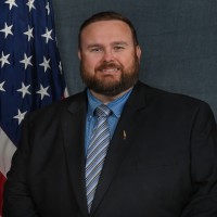 Travis Clark, Esq.