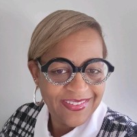 Tangi C. James-Boone, DrBA, MS, PCC, CPC