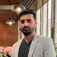 Riaz K