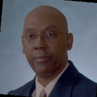 Dwight Lewis MBE, MCGI, BEd., Cert.Ed., CCM