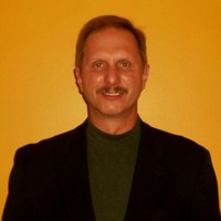 E. Bruce John